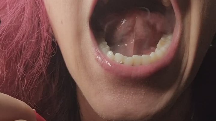 I play with the intense, thick smoke of the cigarette with my tongue and mouth