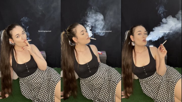 Dangling marlboro reds in a cute dress. My hair up in a ponytail. Visible smoke 