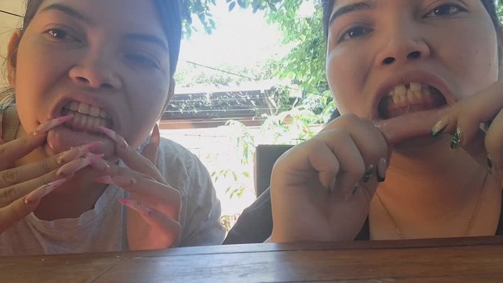 She and I stretched our lips excessively