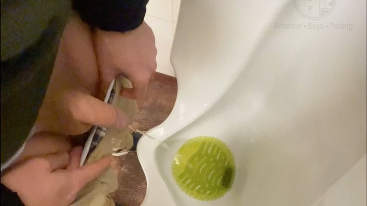 Amateur guy caught pissing in a public toilet's urinal - he then quickly plays w