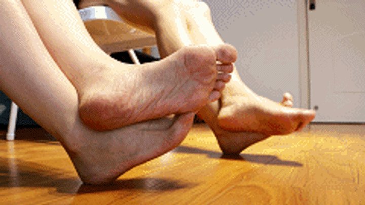 Two models in Asia crossed their legs and rubbed their feet together