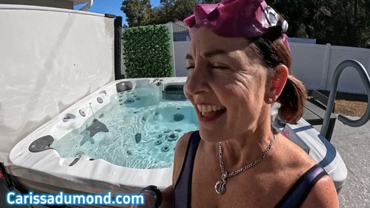Carissa in the purple neoprene bathing suit in the hot tub with mask