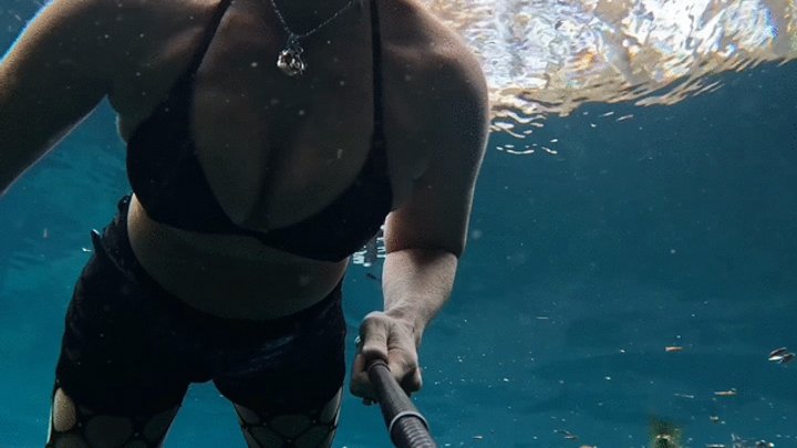 Bounty Hunter Carissa enjoys some underwater time and breast exposure in the spr