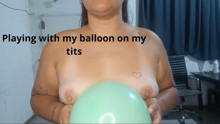Playing with my balloon on my tits