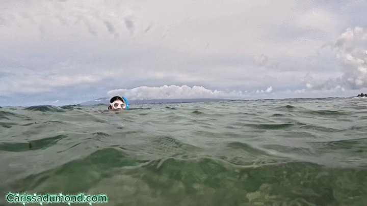 Carissa snorkeling in the Pacific Ocean in the hibiscus bikini