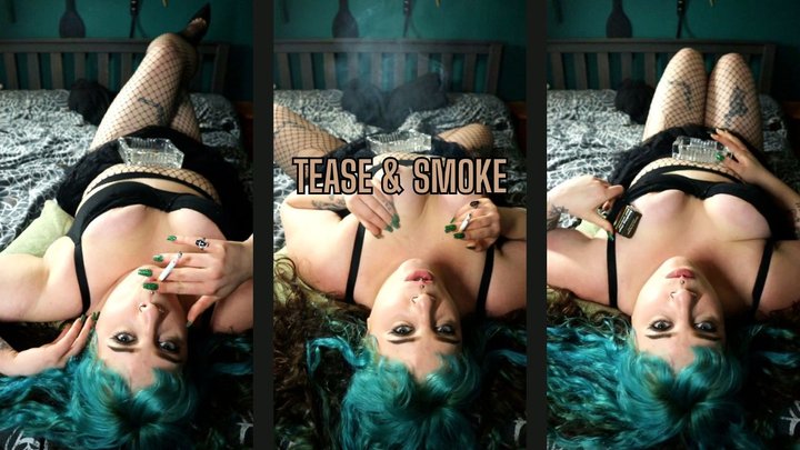 Goddess Kinx's Smoky Tit Worship: Reclined Seduction with Exposed Cleavage & Haz