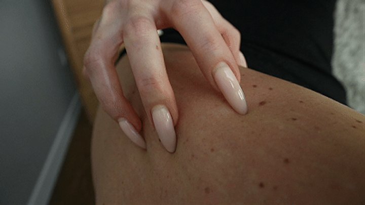 Long sharp nails scratching leg. WMV