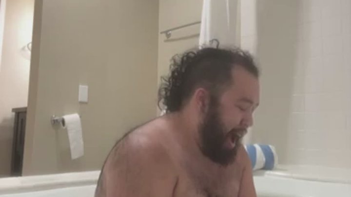 Fat Guy Relaxes in a Tub
