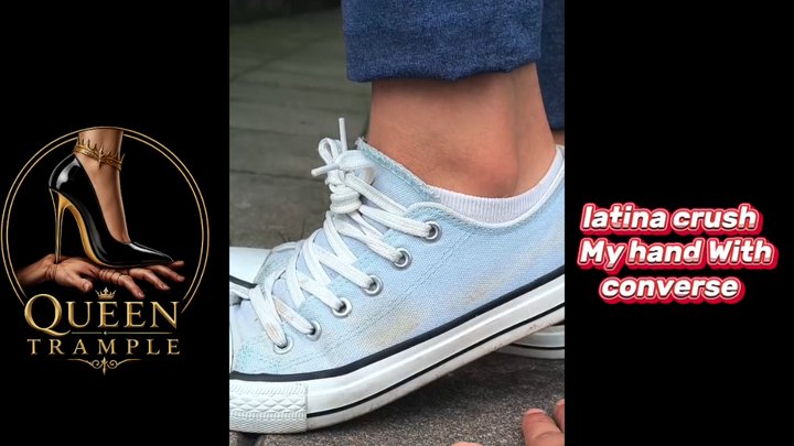 woman crushes my hand with her Converse.