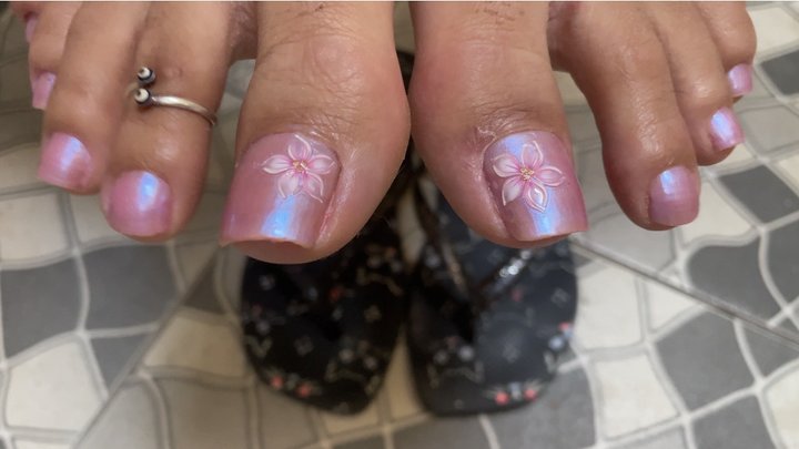 showing off perfect nails and feet