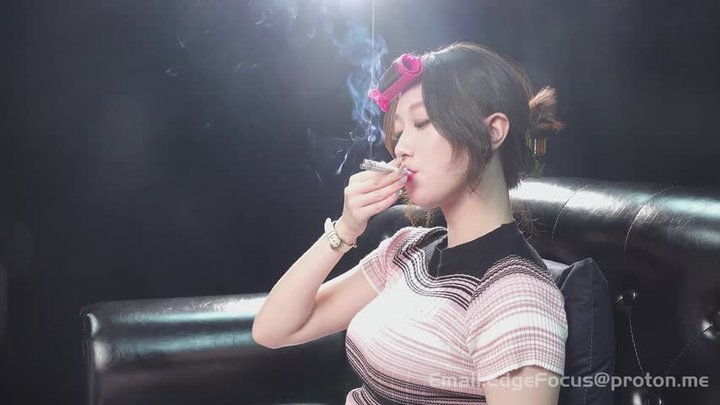 Asian Woman Smoking Cigarette Blowing Thick Smoke Rings and Deep Inhales on Leat
