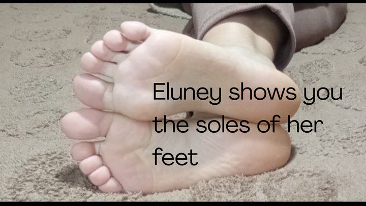Eluney shows you the soles of her feet