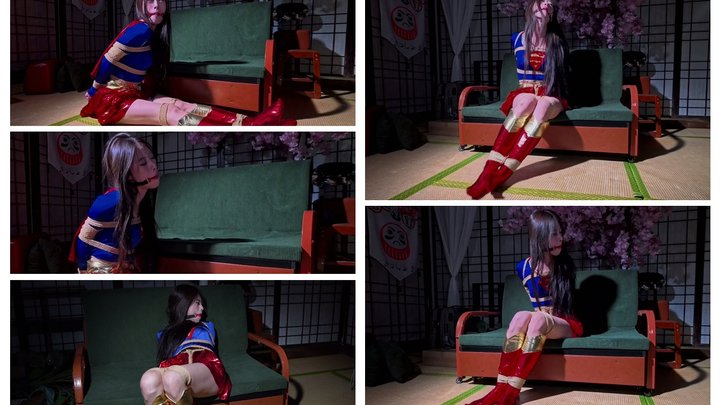 Supergirl is fitted with a gag that makes her pout causing a large amount of sal