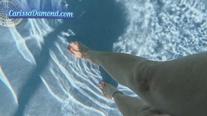 Carissa in a cropped white tank top and panties swimming