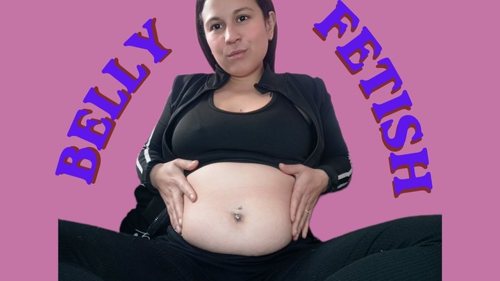 Playing with my soft belly on the couch… can you imagine touching it?