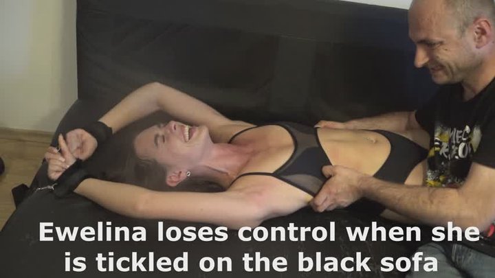 Ewelina loses control when she is tickled on the black sofa