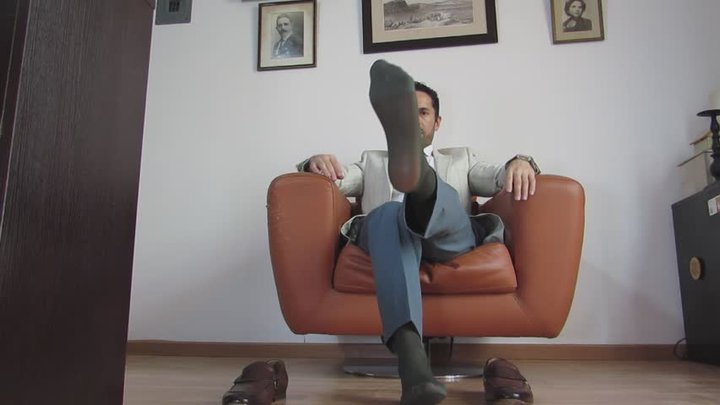 Gio wearing green sheer socks and suit