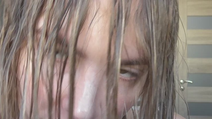 A blonde-haired woman sniffs her natural wet lips!