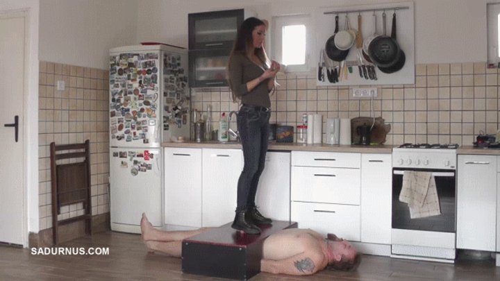 Mistress Tatjana puts out his cigarette on the slave's sperm B wmv
