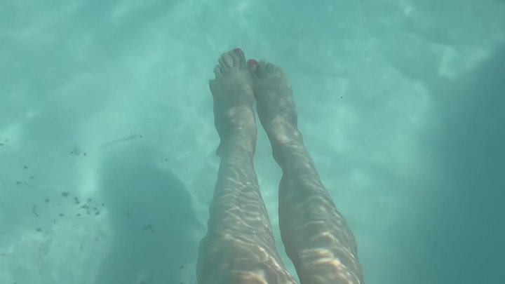 Artemisia Love showing her cute feet underwater