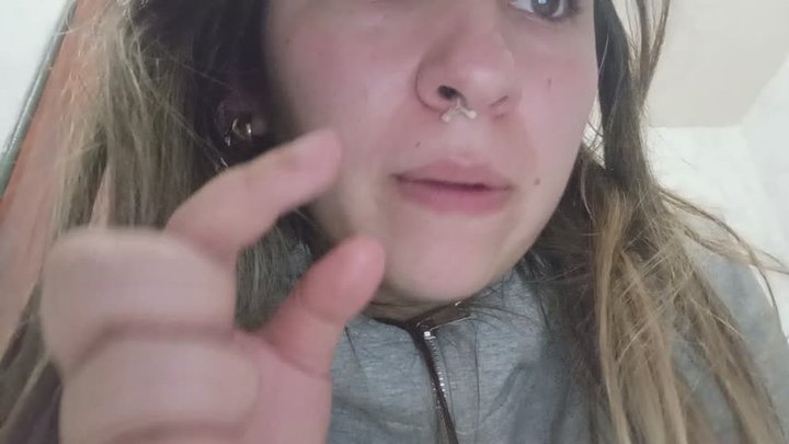The snotty girl picks her nose and swallows them.