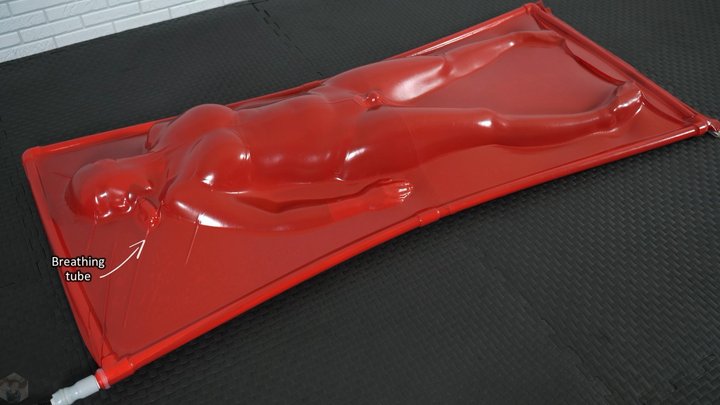 Orgasm inside a red vacuum bed breathing through a tube vibrator on full power (