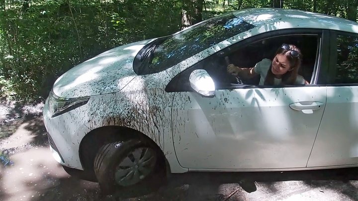 Nicky driving through the forest and getting stuck in the mud
