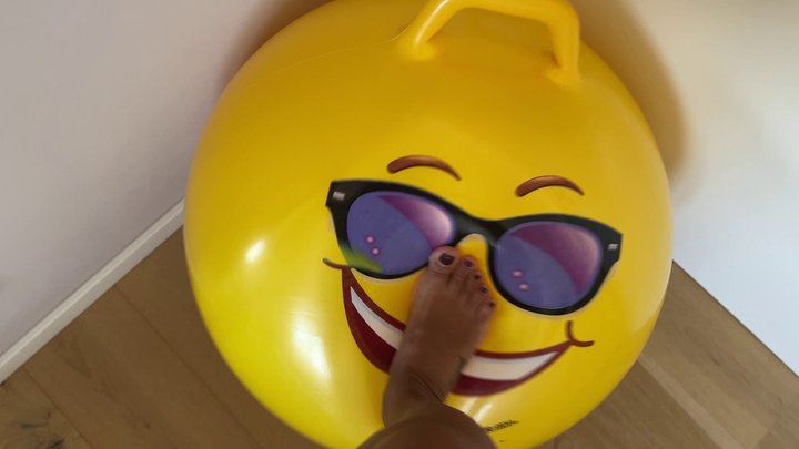 Feet play with smiley hopper ball