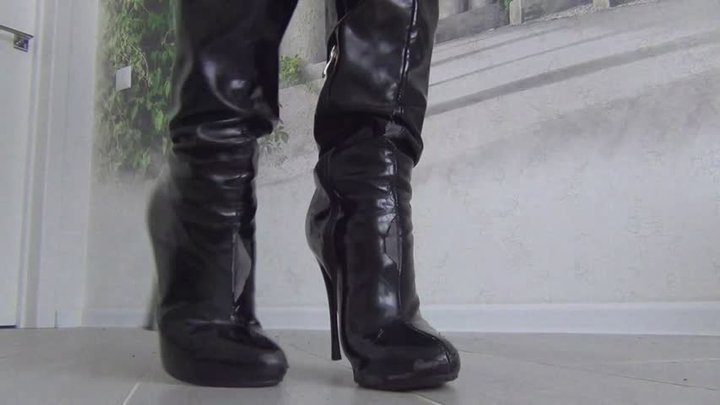 She cut the black boots with scissors and tore them with her hands b
