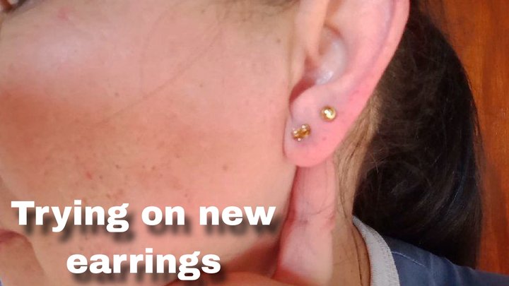 Trying on new earrings