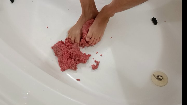 Raw Ground beef bare foot play