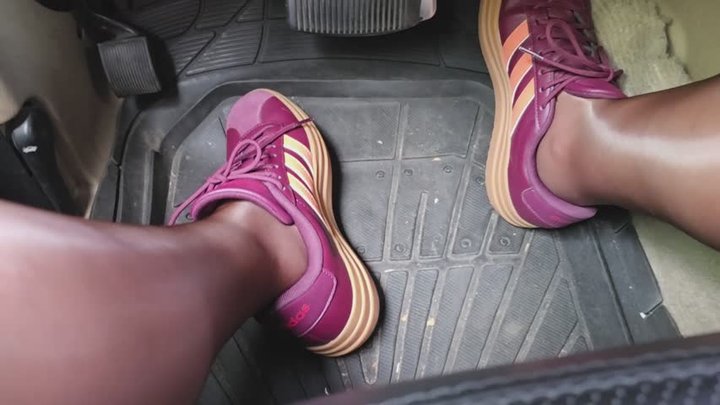 Milah driving on sneakers and pantyhose