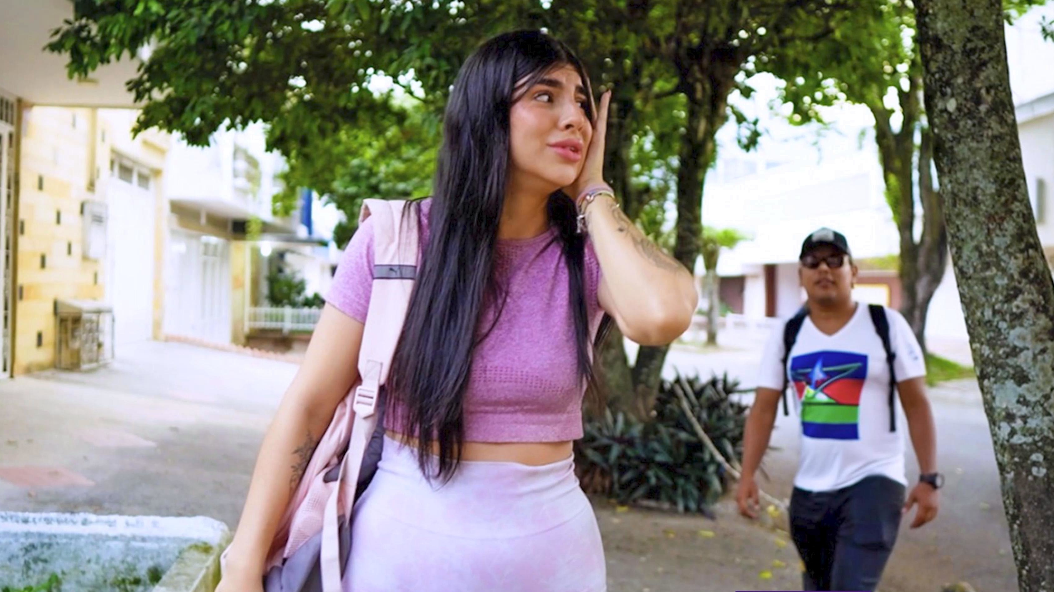 A stranger stares at a white Colombian woman