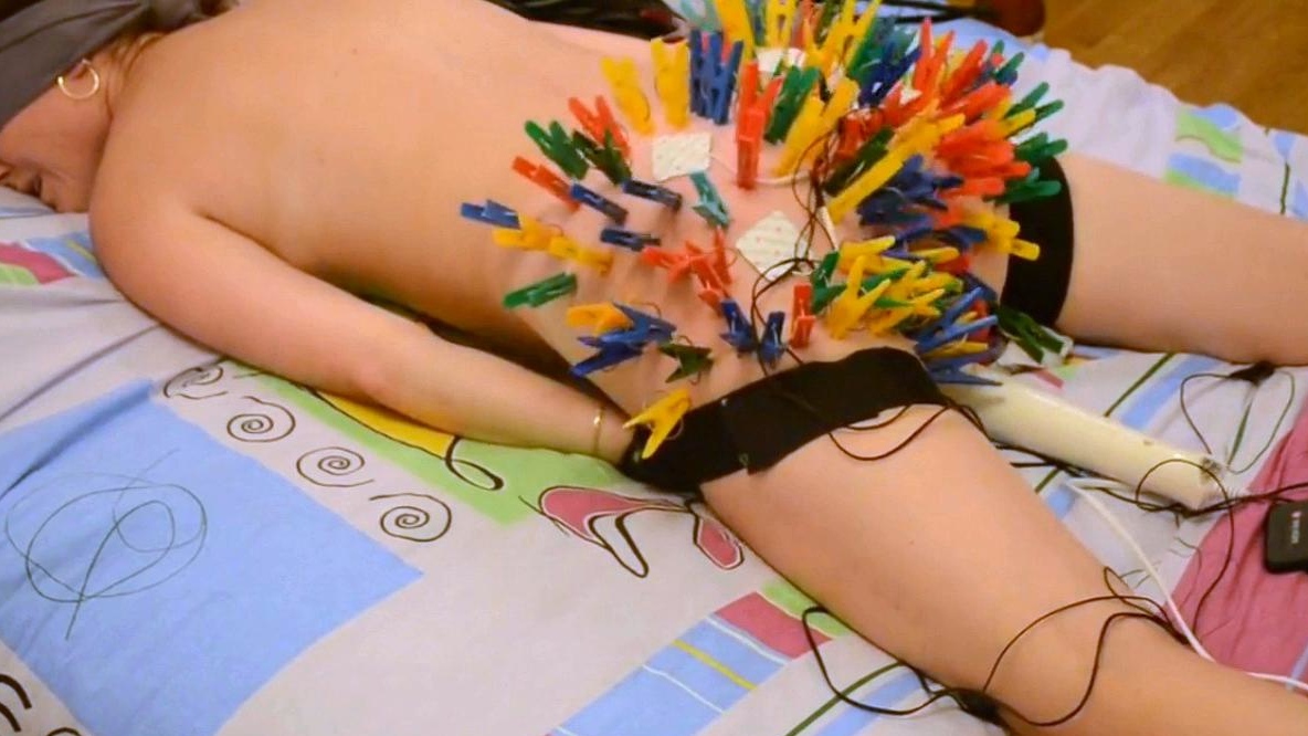 more than a hundred clothespins on her butt!