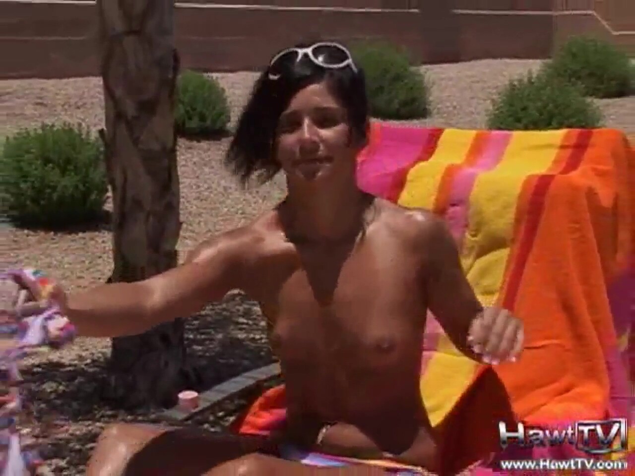 Hot teen sunbathing outdoors in the hot sun